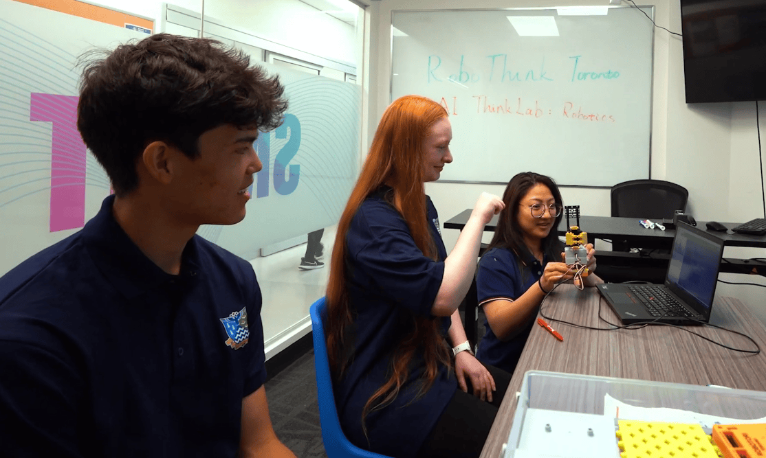 Students working together on a robotics project in class
